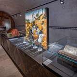 pomieszczenie z księgą w gablocie, malowidłem oraz sadzonkami roślin Muzeum Duchowości i Kultury Cystersów  Opactwo Cystersów Kraków Mogiła